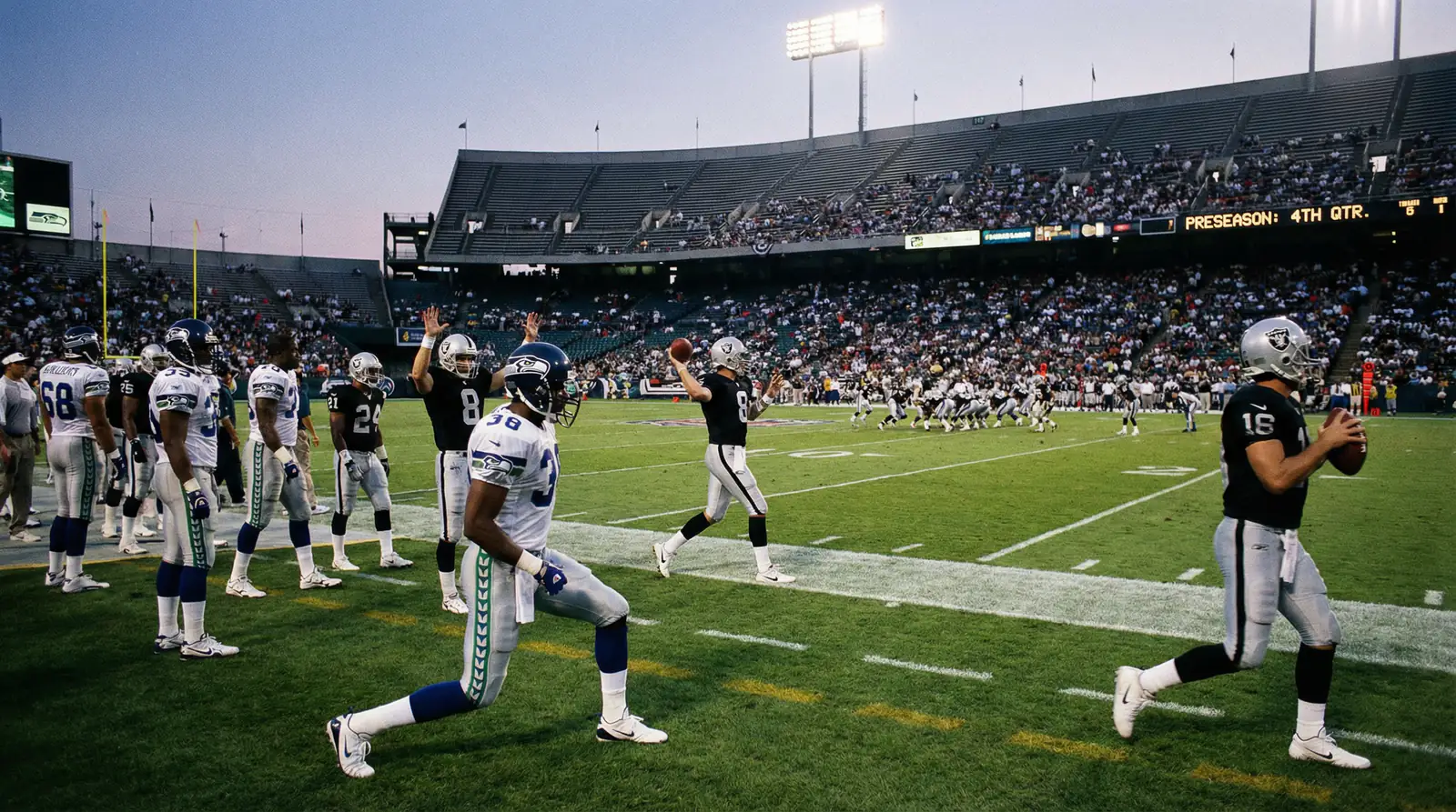 NFL preseason game with backup players on the sideline warming up